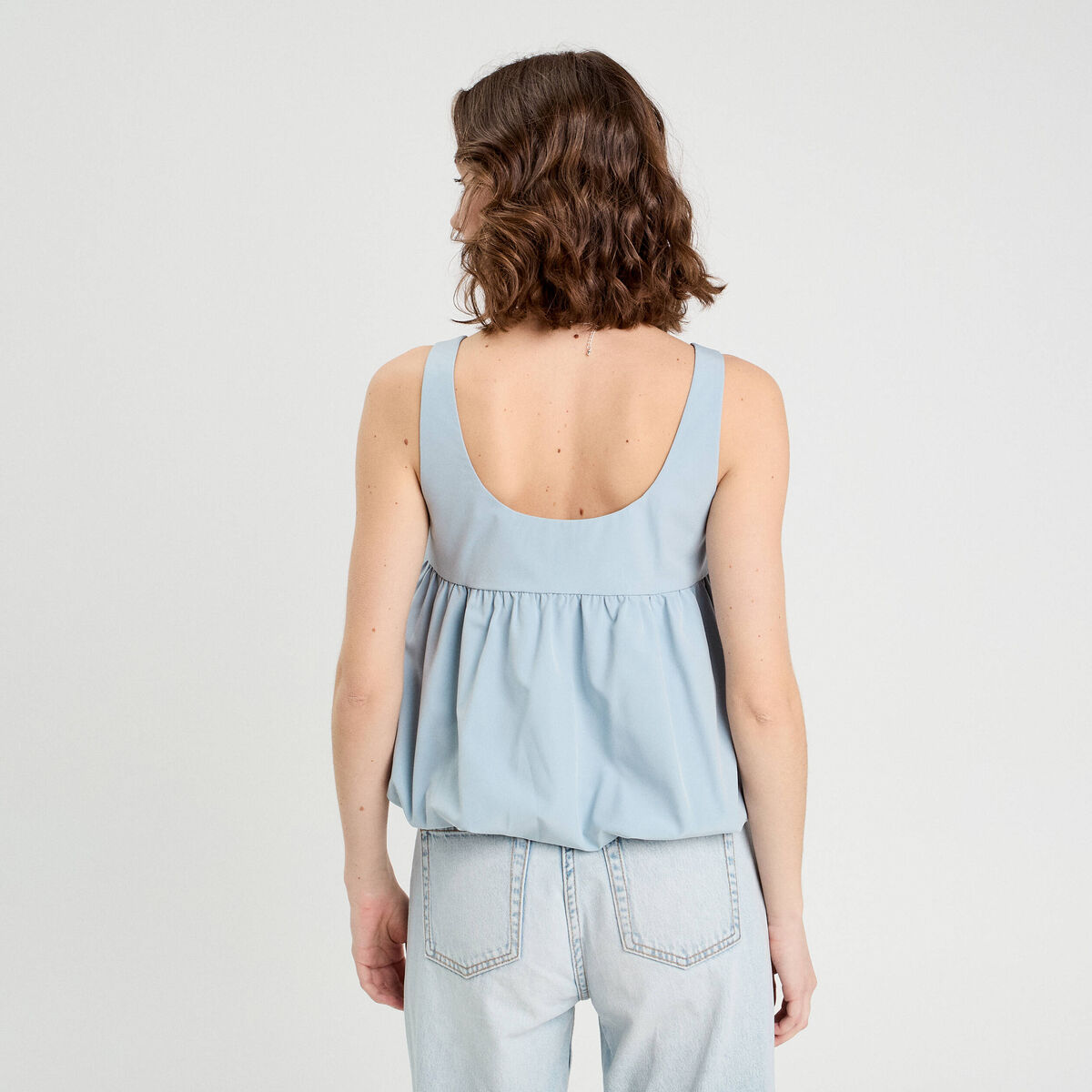 Débardeur effet boule et noeud bleu clair femme