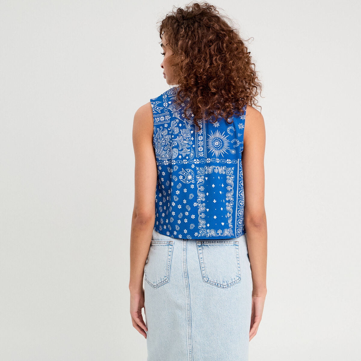 Blouse nouée sans manches bleu femme