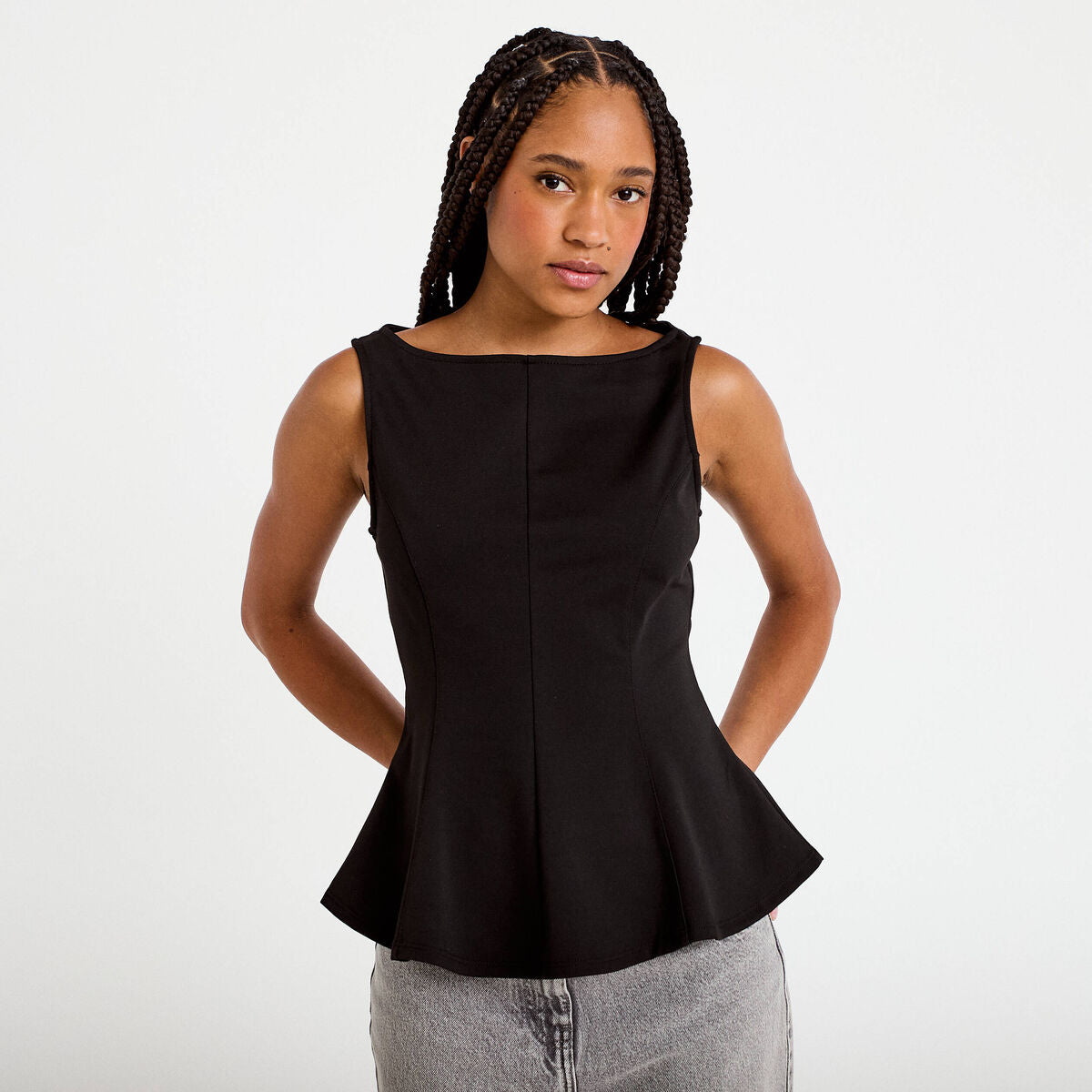 Top péplum sans manches col rond noir femme