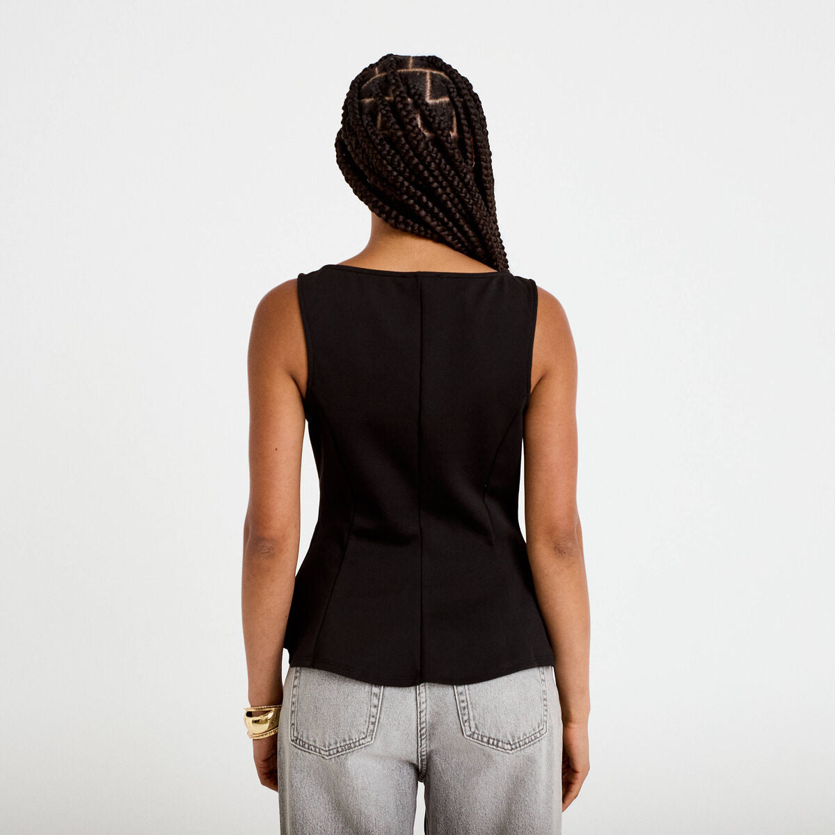 Top péplum sans manches col rond noir femme