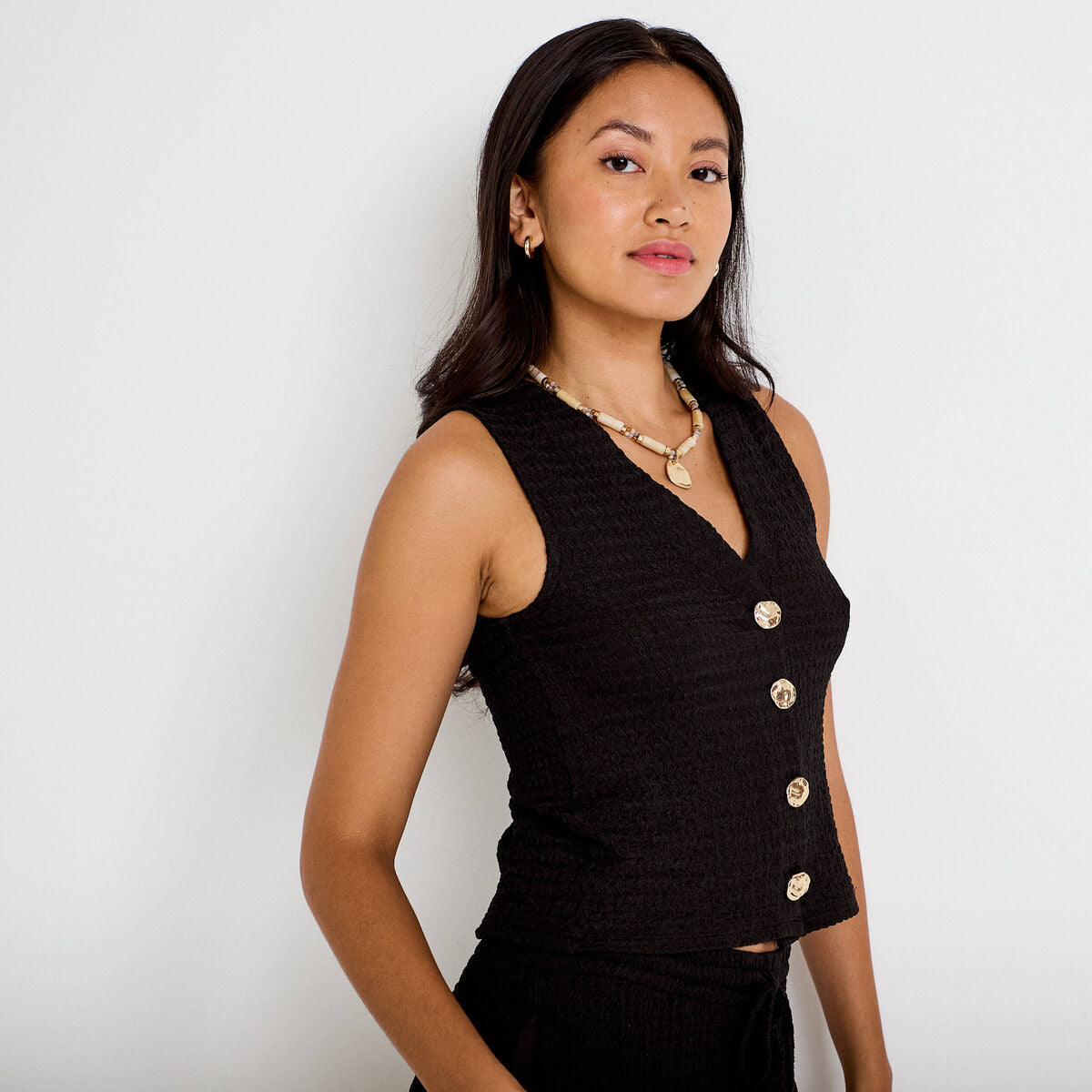 Gilet cintré sans manches col v noir femme