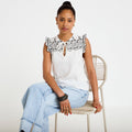Blouse décolleté sans manches brodée noir femme