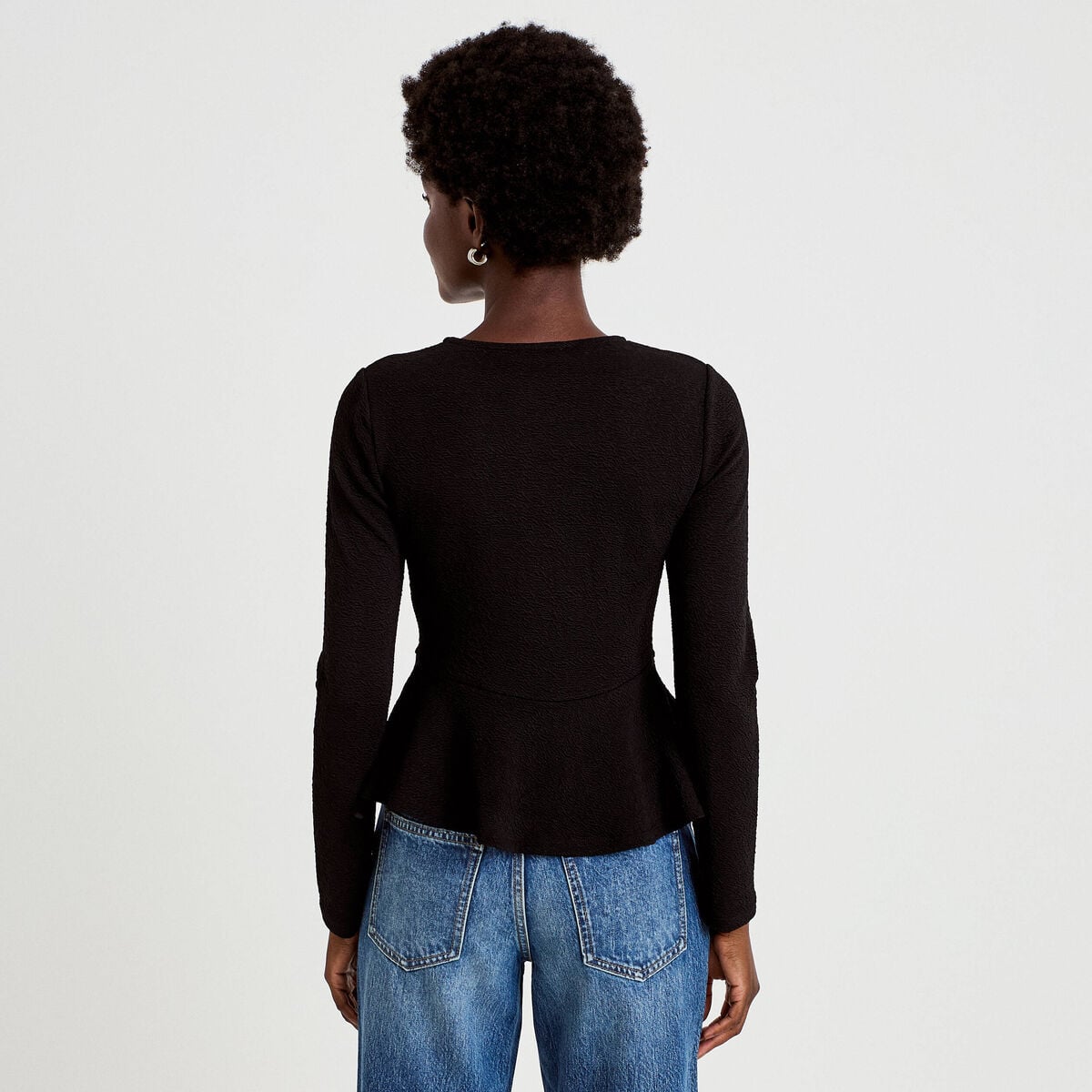 Top péplum ajusté manches longues noir femme